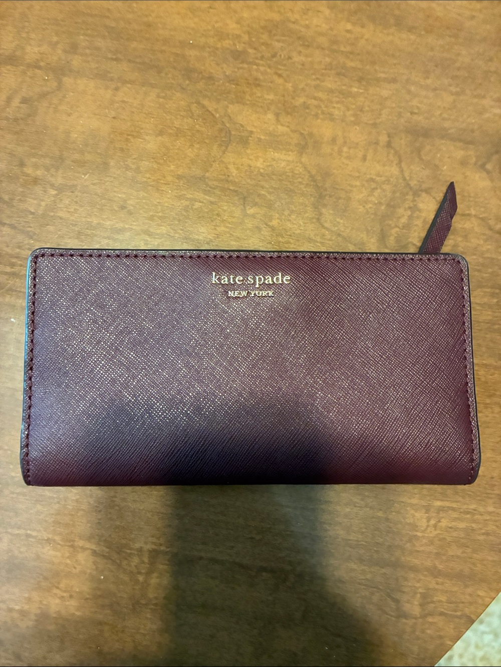 kate spade Burgundy Saffiano Wallet with Gold Logo